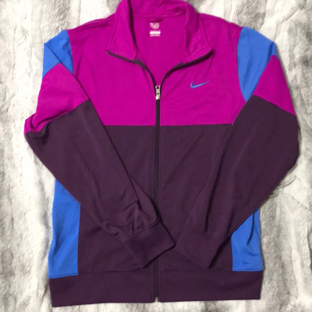 Nike woman’s zip up warm up jacket size large in magenta/blue/purple.